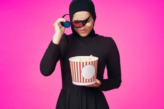 cheerful woman in 3D glasses popcorn entertainment movies studio lifestyle. High quality photo