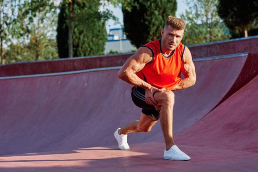 man doing exercises outdoors in the park. High quality photo