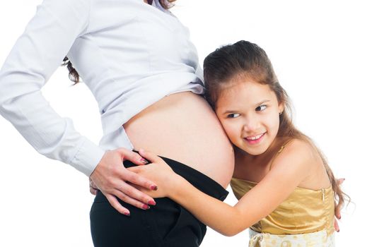 cute little girl hugging belly pregnant mom