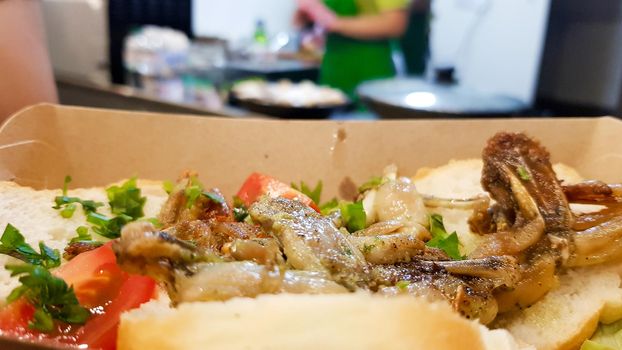 Cambodian dish grilled frog. Tasty exotic dishes are served in the restaurant. Street food frog legs.