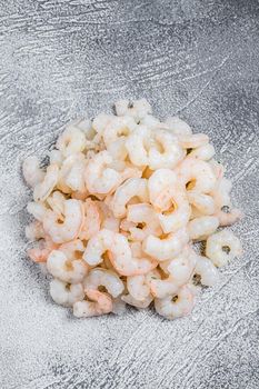 Peeled raw Shrimps, Prawns on a table. White background. top view.