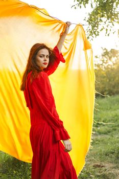 pretty woman nature yellow cloth fresh air glamor. High quality photo