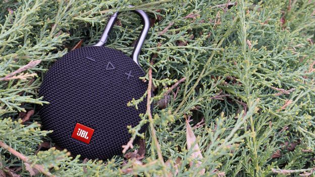 Waterproof round Bluetooth-speakers JBL Clip 3 in black color with a carabiner. Digital music and audio concept. Mini, suitable for travel. Ukraine, Kiev - June 09, 2021