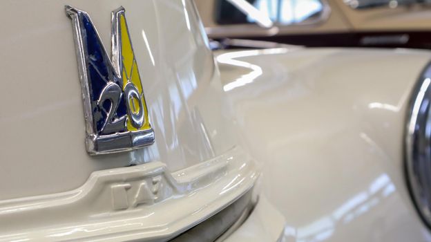 Detail, sign or logo of the old Soviet car Gaz-M20 Pobeda. An old legendary car at the Museum of Retro Technology. Ukraine, Kiev - June 10, 2021