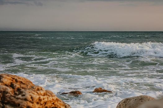 Rocks and sea. Dramatic scene. Composition of nature.