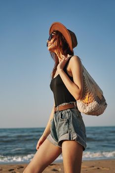 woman walking on the beach landscape sun fun lifestyle. High quality photo