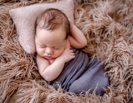 Cute sleeping newborn baby boy