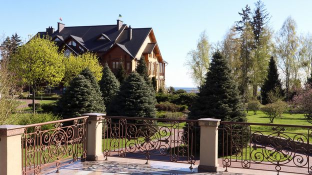Luxurious residence of the former President of Ukraine Viktor Yanukovych on the shore of the pond. Luxurious house Honka in Mezhyhirya. Ukraine, Novye Petrovtsi - June 05, 2021