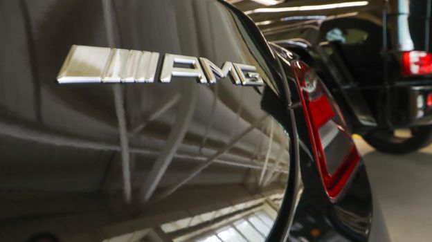 Mercedes Benz SLS amg Roadster, 2012. Double luxury supercar in the back of a coupe. The sports car is equipped with a 6.2 L V8 M159 engine. Ukraine, Kiev - June 09, 2021
