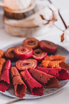 Fruit rolls pastille. Apple candy rolls, chips. Shredded and dried fruits. Useful sweetness. Food dessert. Homemade snack. Degidrated fruits. Natural and healthy, Sugar-Free, nutrition.