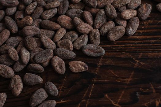 Raw cocoa beans two types Venezuela on brown background.