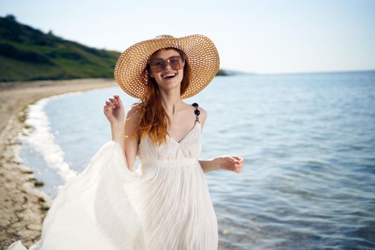 pretty woman with hat on island beach ocean summer fun. High quality photo