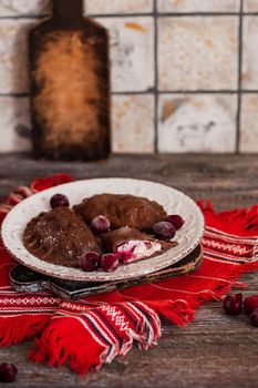 Dumplings, filled with cottage cheese and cherries and served with suagr. Varenyky, vareniki, pierogi, pyrohy. Dumplings with filling.