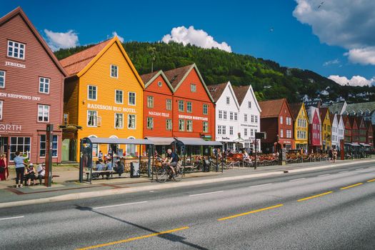 Bergen, Norway. View of historical buildings in Bryggen. Hanseatic wharf in Bergen, Norway July 28, 2019. UNESCO. Famous Bryggen street with wooden colored houses in Bergen Akerbrygge distric.