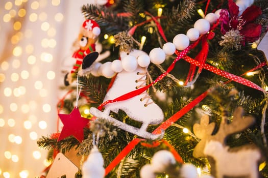 Christmas and New Year background with Eve Tree decorations. Wooden handmade skates as toy for holiday fur .