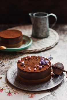 Plate with slice of tasty homemade chocolate cake on table.