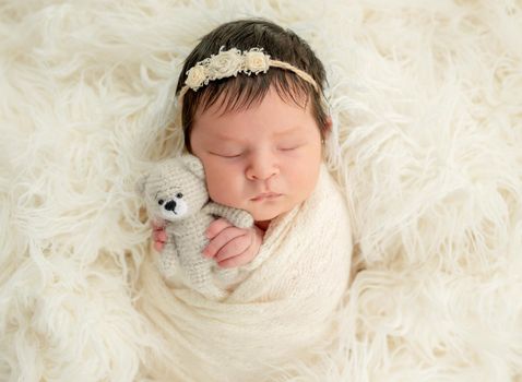 newborn baby girl sleeping sweetly