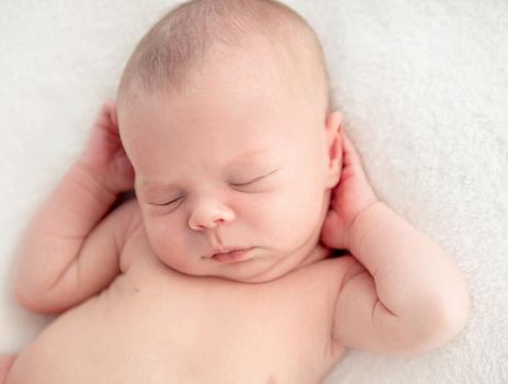 newborn baby girl sleeping sweetly