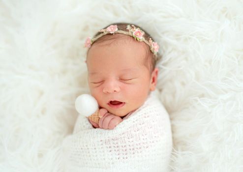 newborn baby girl sleeping sweetly in the basket