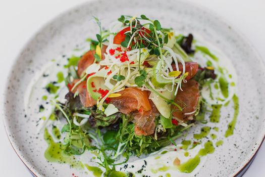 Smoked salmon salad, with mixed greens, avocado, grapefruit. Delicious healthy eating.