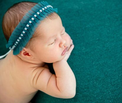 newborn baby girl sleeping sweetly