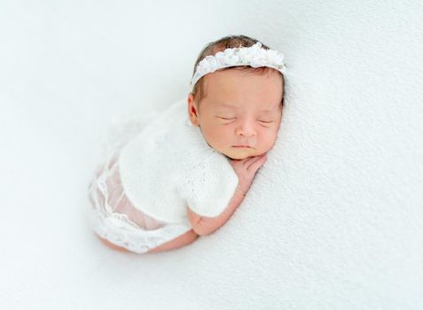 newborn baby girl sleeping sweetly