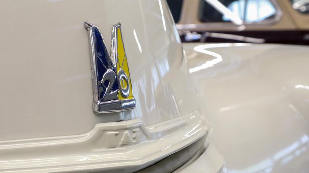 Detail, sign or logo of the old Soviet car Gaz-M20 Pobeda. An old legendary car at the Museum of Retro Technology. Ukraine, Kiev - June 10, 2021