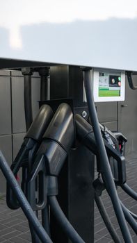 Public charging station for electric vehicles in the parking lot. Charger for public electric vehicles located in the parking lot. Ukraine, Kiev - June 14, 2021