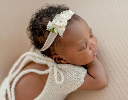 Portrait of cute baby with diadem on her head