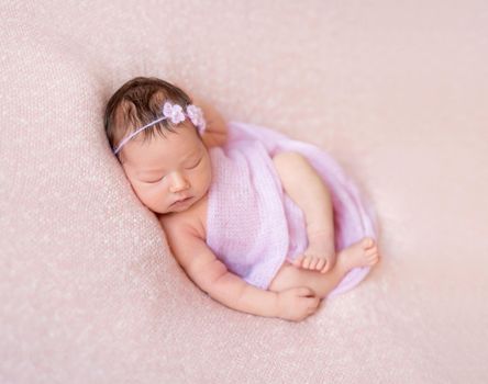 Cute sleeping newborn baby girl