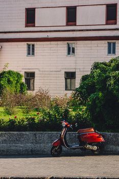 Red Scooter Parked on a Typical Odessa Street in City Centre.