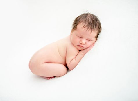 Comfortable pose for sleep of innocent newborn