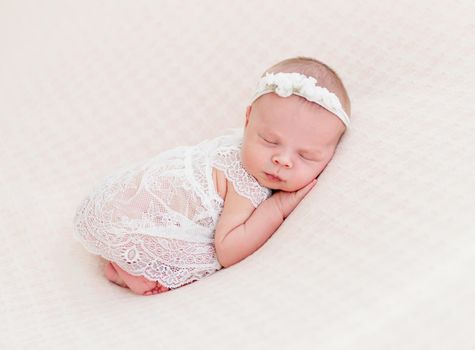 newborn baby girl sleeping sweetly