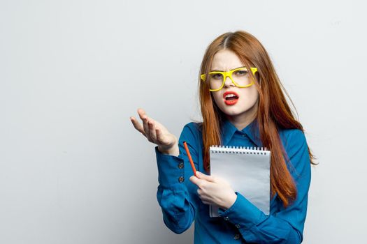 woman secretary with yellow glasses notepad work official. High quality photo