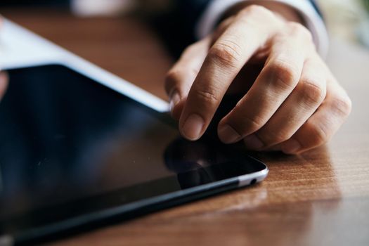 work documents tablet in technology in a cafe. High quality photo
