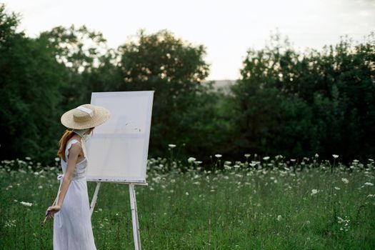 pretty woman in white dress outdoors drawing art creative. High quality photo