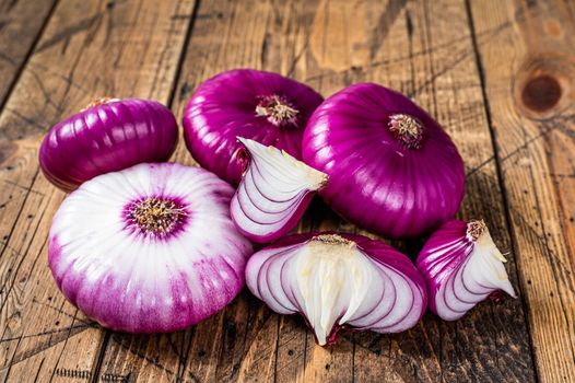 Sweet red onion on a wooden table. Wooden background. Top View.