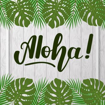 Lettering Aloha on gray wooden background with tropical leaves.