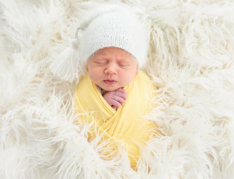 Cute newborn baby in knitted hat