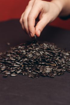 natural product sunflower seeds handing close-up food. High quality photo