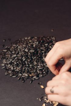 natural product sunflower seeds handing close-up food. High quality photo