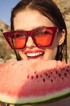 woman eating watermelon outdoors Sun summer close-up. High quality photo