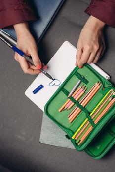 green pencil case with pencils design object school supplies. High quality photo