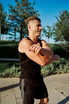 sporty man exercise fitness workout outdoors with dumbbells. High quality photo