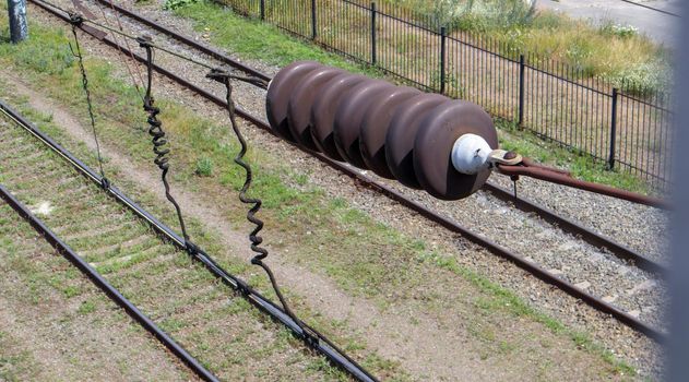 A railroad overhead power line component along a track with a rail electrification system that supplies power to an electric train. Overhead line wire on a rail track