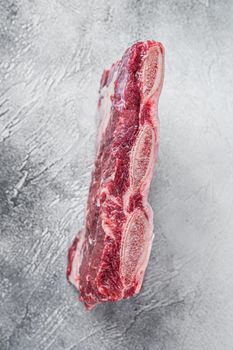 Raw beef short ribs kalbi on kitchen table. White background. Top view.