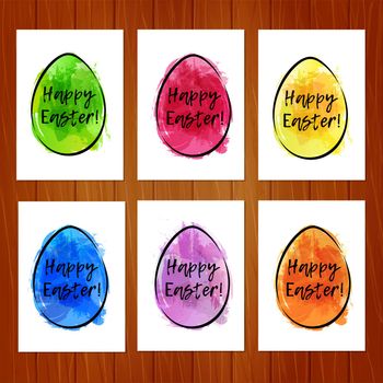 Set of Easter cards with colorful eggs on wooden background. Imitation of watercolor. Template for greeting Easter cards.