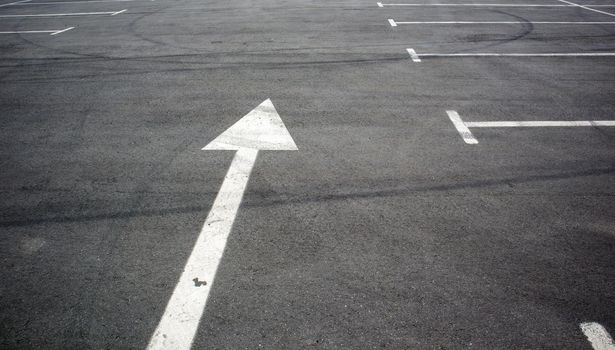 Parking kiosks in the parking lot, marked with white lines. Empty parking lot. Outdoor car park with freshly painted kiosk lines. Outdoor parking on an asphalt road