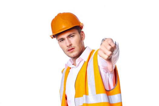 working man in orange uniform posing construction. High quality photo