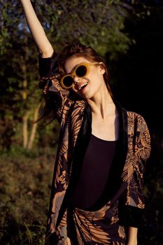 woman wearing sunglasses outdoors posing fashion. High quality photo